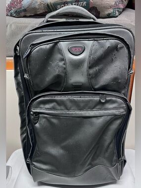 Tumi Grey Suitcase 22x9x14”